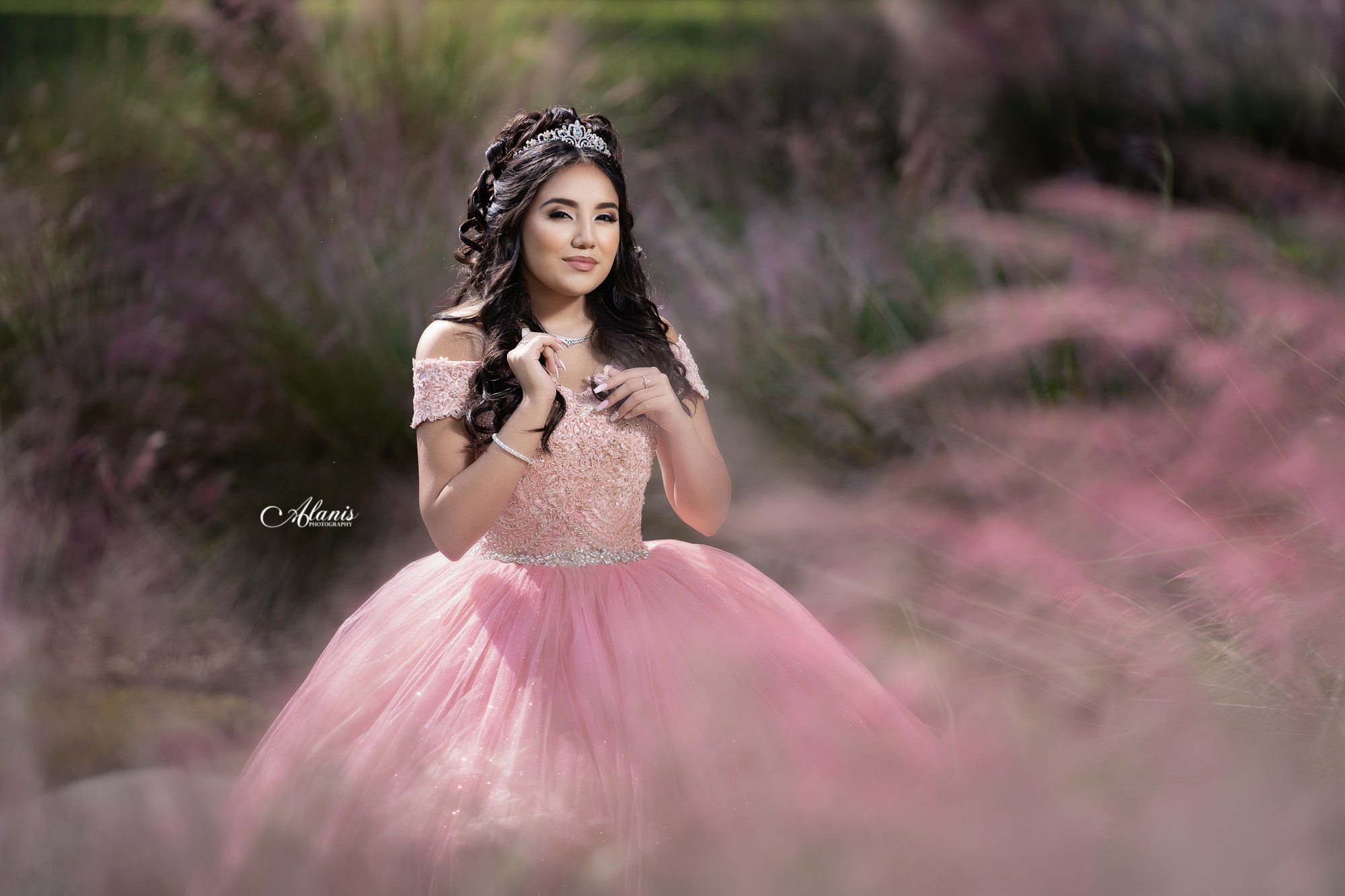 Soft pink quinceañera portrait framed by flowers
