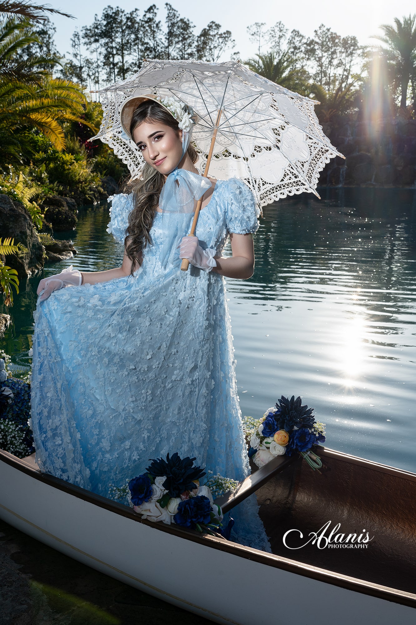 Quinceañera in a pale blue gown aboard a decorated boat