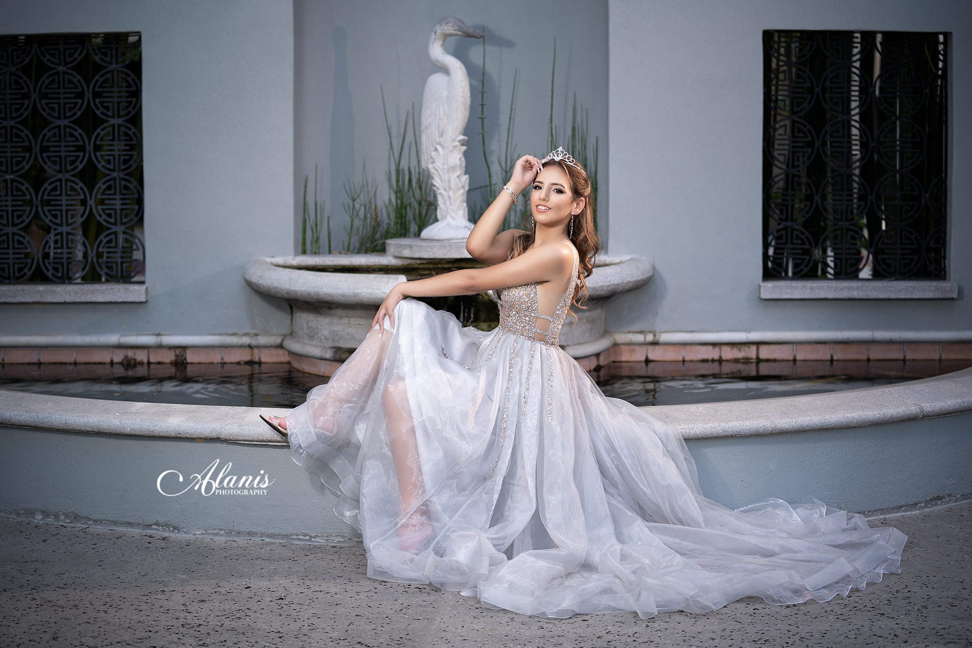Silver quinceañera gown at modern architecture