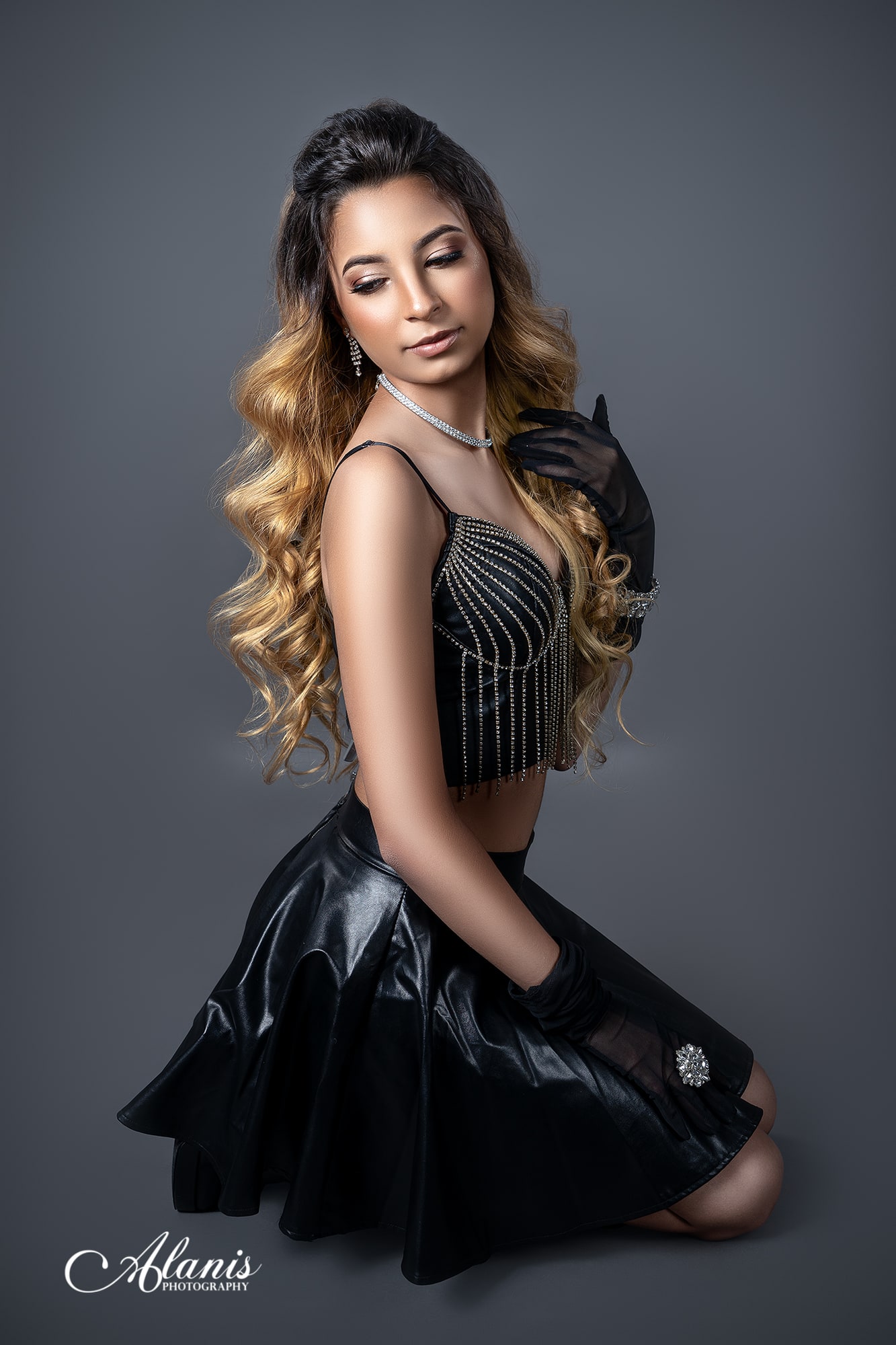 Editorial quinceañera studio portrait in black