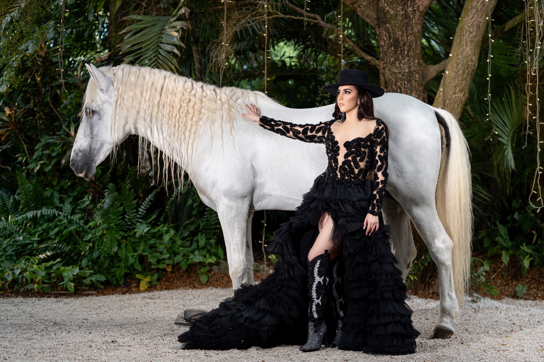 Quinceañera with a white horse