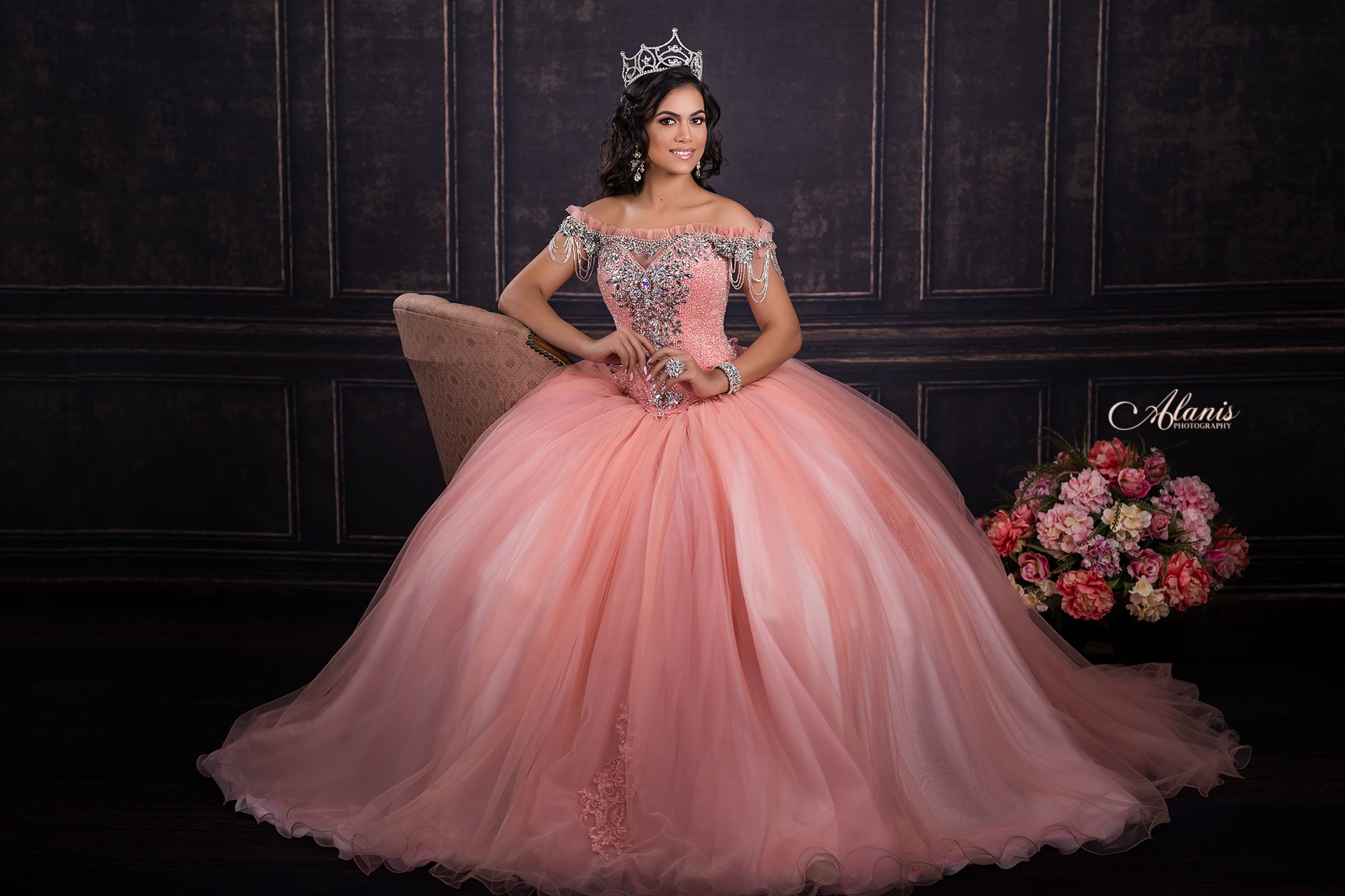 Blush quinceañera gown against a paneled studio backdrop