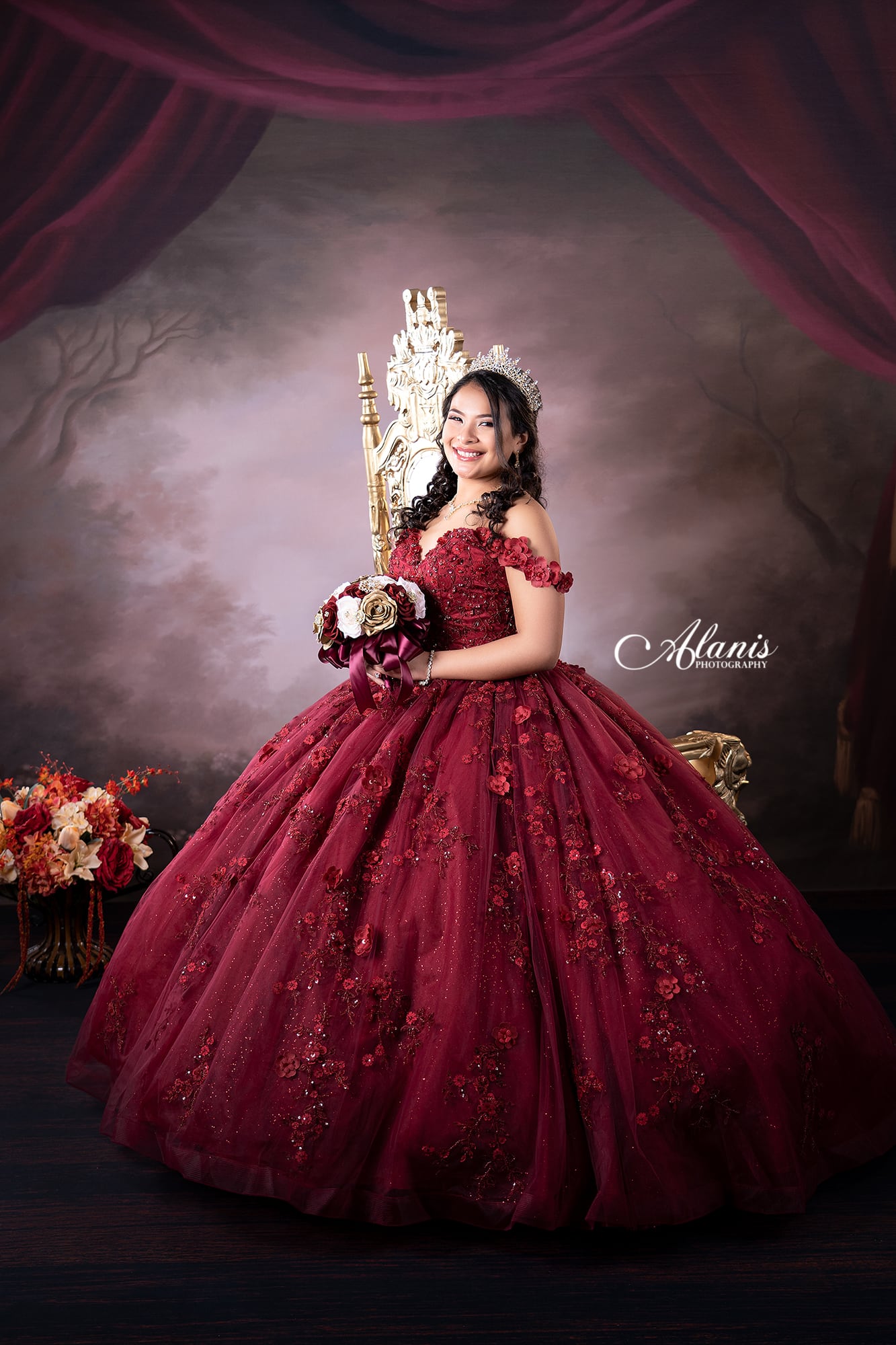 Burgundy quinceañera portrait with a classic studio background