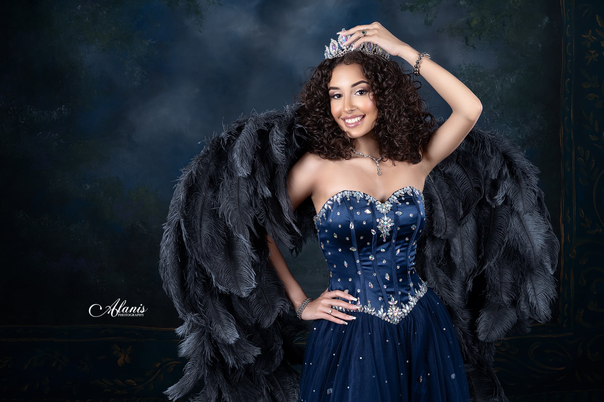 Blue feathered quinceañera gown in a modern studio portrait