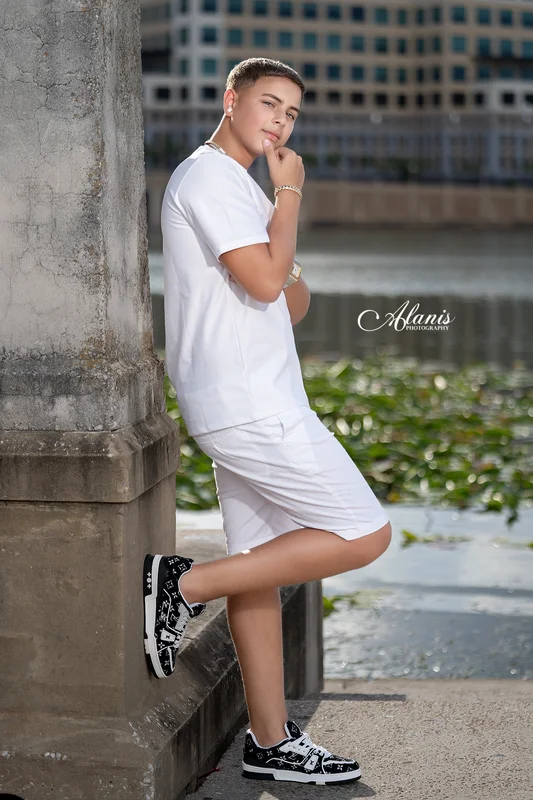 XV for Him outdoor portrait in a white outfit