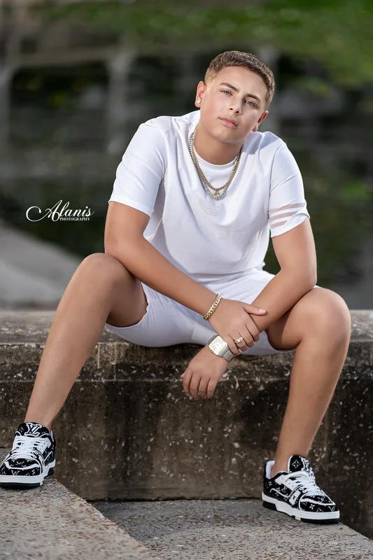 XV for Him outdoor portrait in a white outfit