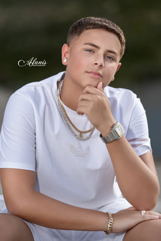XV for Him outdoor portrait in a white outfit